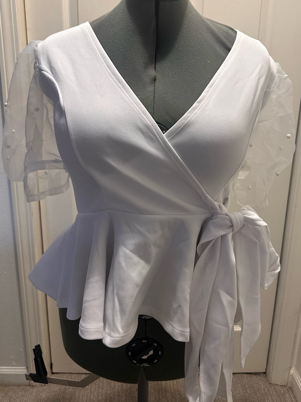 Women's White Wrap Peplum Blouse with Sheer Pearl Sleeves